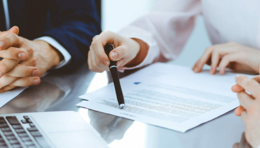 1200 business law attorney pen pointing contract