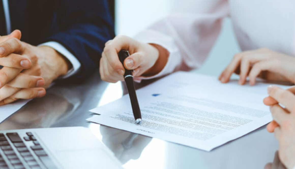 1200 business law attorney pen pointing contract