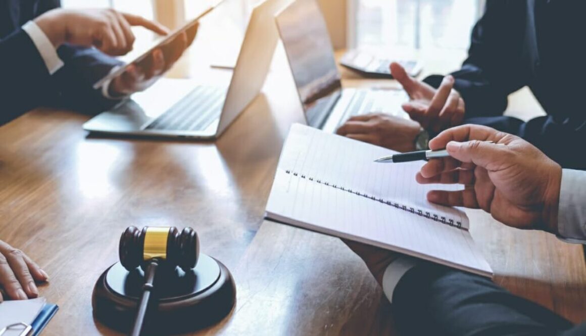 Businessman and lawyer discuss lawsuits in the office.