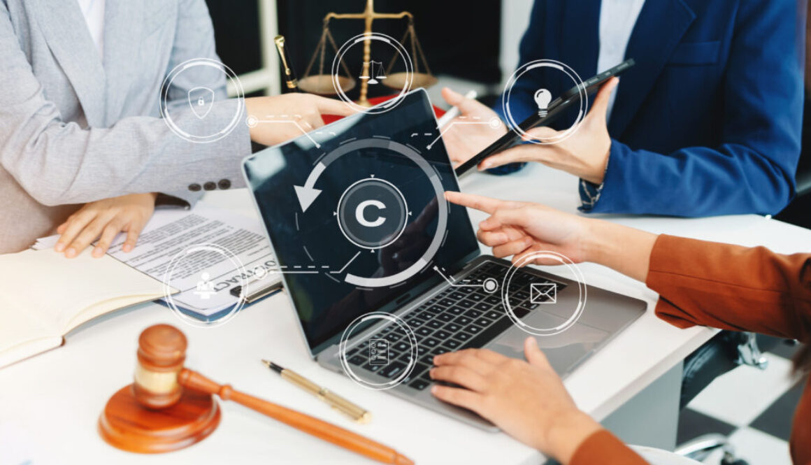 Copyright or patent concept, Person hand using laptop computer, tablet and smartphone with virtual screen