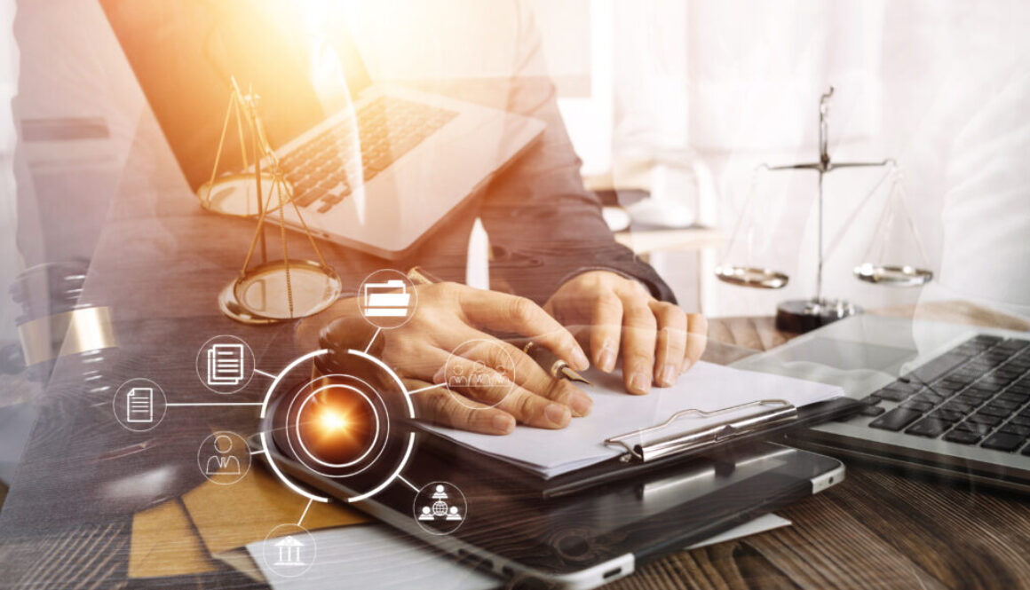 Business and lawyers discussing contract papers with brass scale on desk in office. Law, legal services, advice, justice and law concept picture with film grain effect