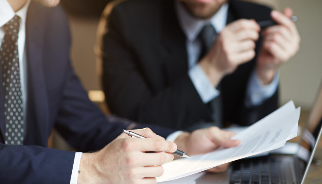 Successful Business Partners Discussing Contract