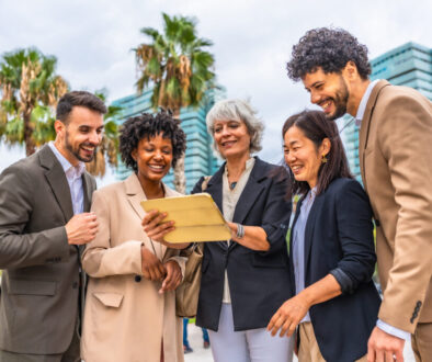 Multi-ethnic colleagues using digital tablet during outdoor business meeting
